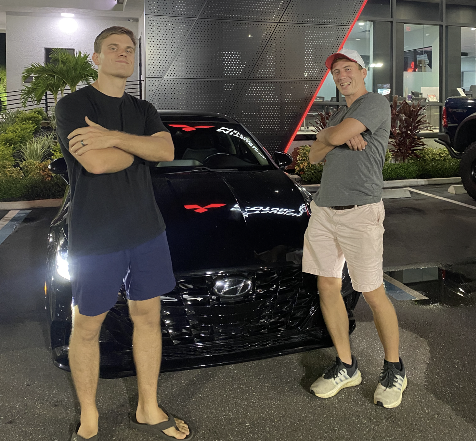 Jack standing with his missionary friend in front of the car they bought him